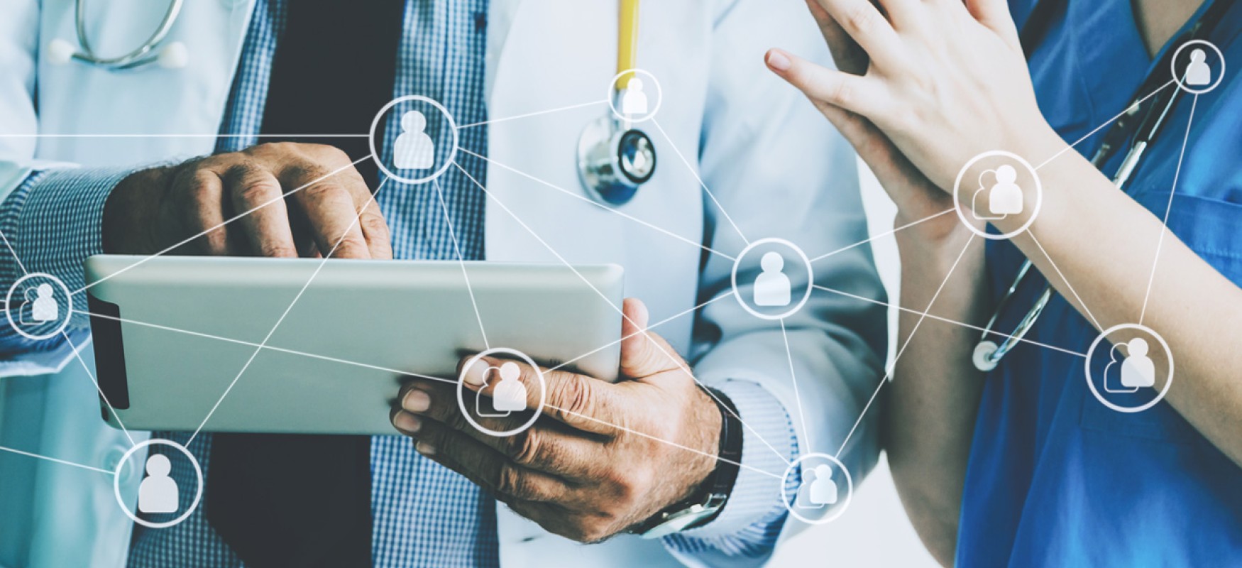Doctor and nurse holding an ipad with illustrative network