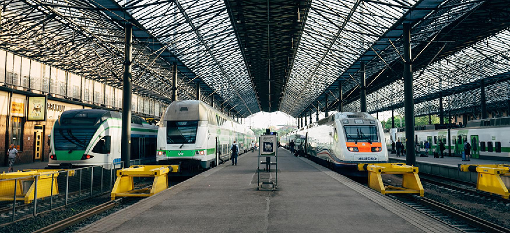 Train platforms and trains at a railway station.