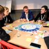 People playing the Nordic Urban Mobility 2050 Futures Game board game.