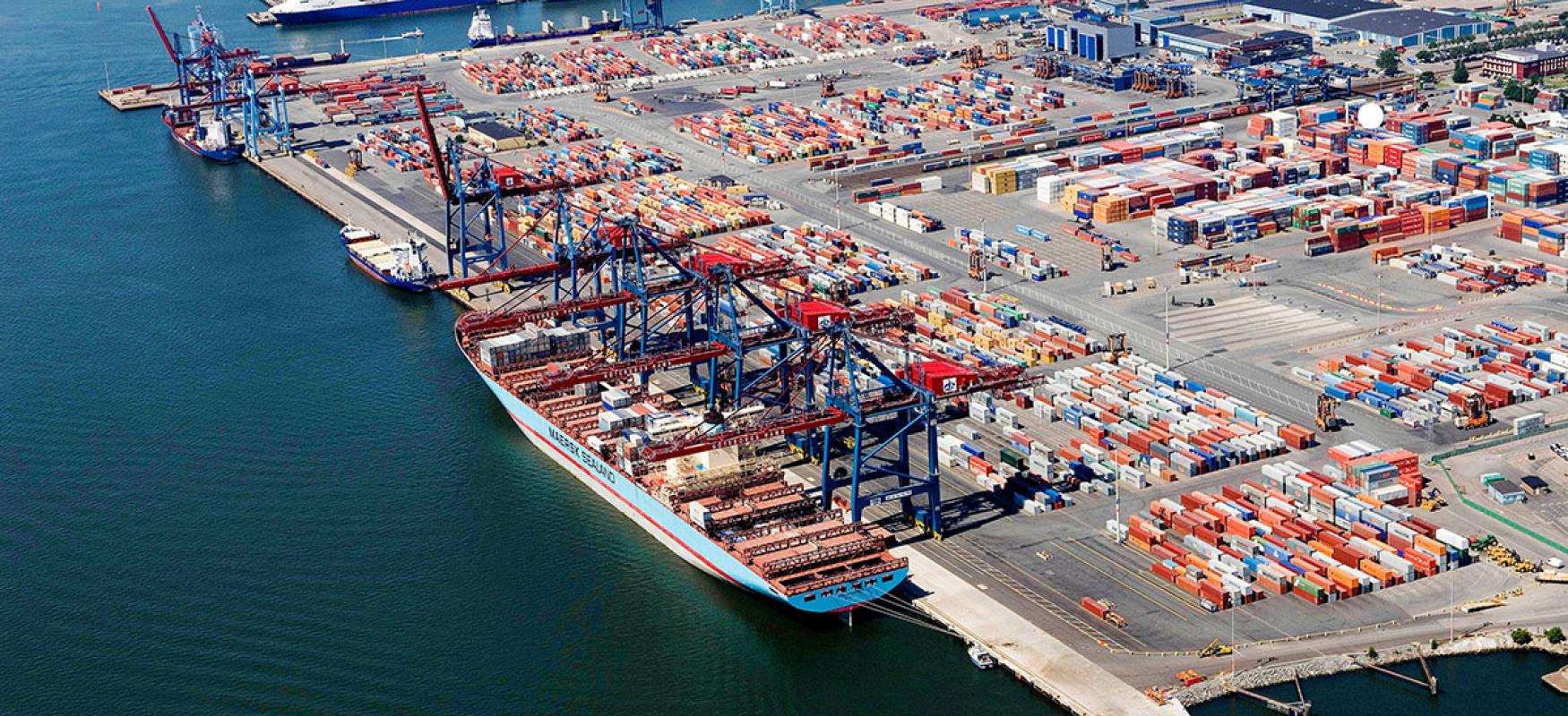 Areal shot of the port in Gothenburg with containers and a container ship.