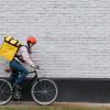 Woman courier on bike